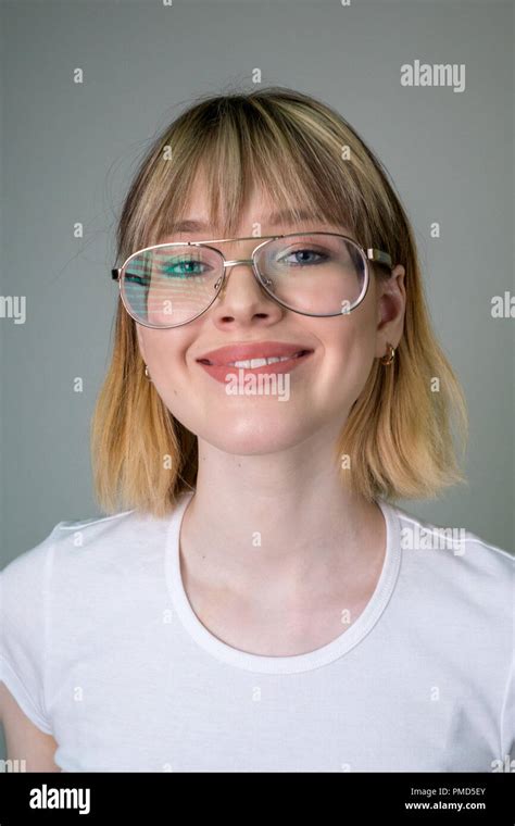 blonde hair girl with glasses|Blonde teen girl and glasses Stock Photos and Images